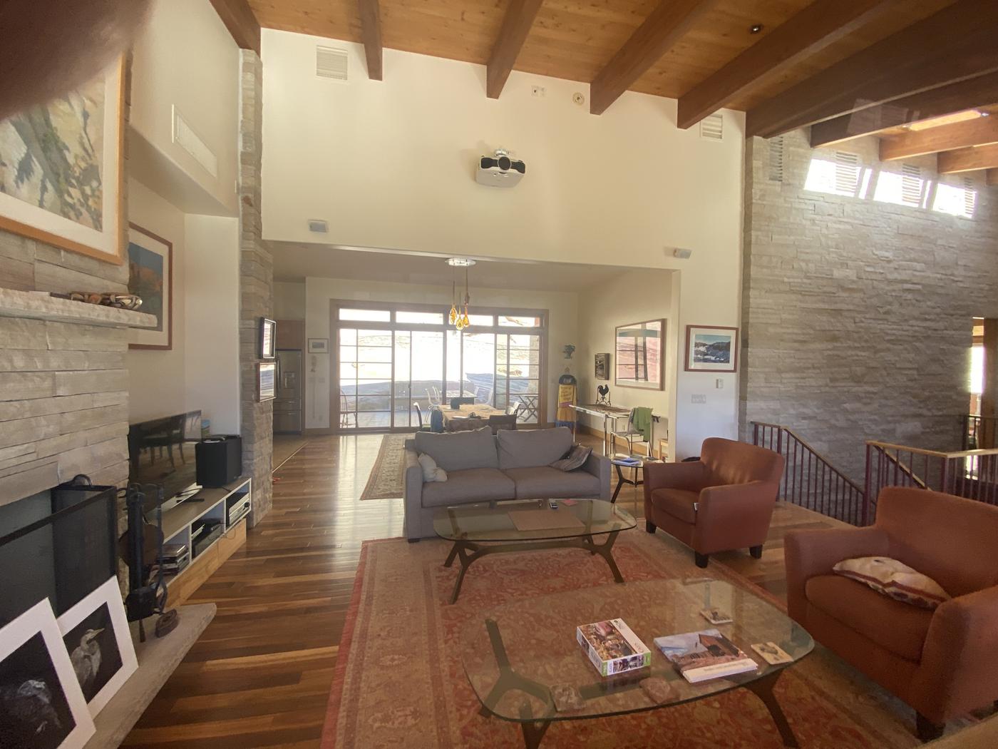 Great room interior with painted walls and timber ceiling