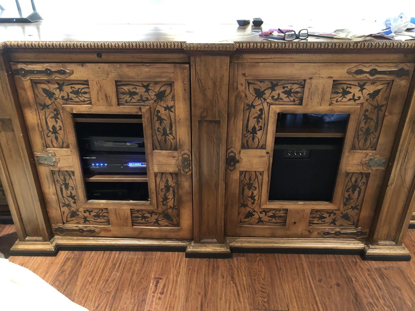 Hand-carved wood cabinetry with custom finish work