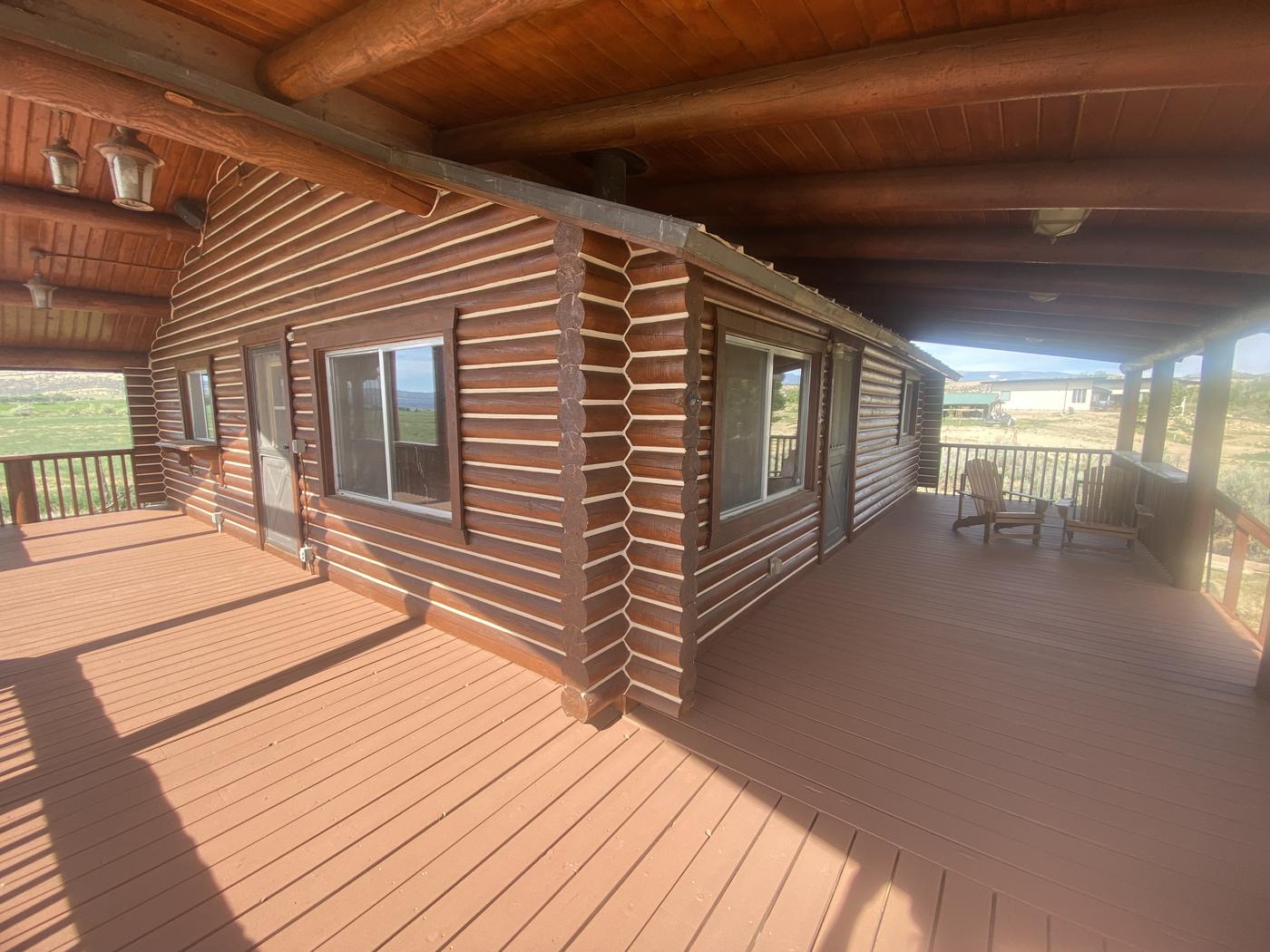 Log home deck with fresh protective stain