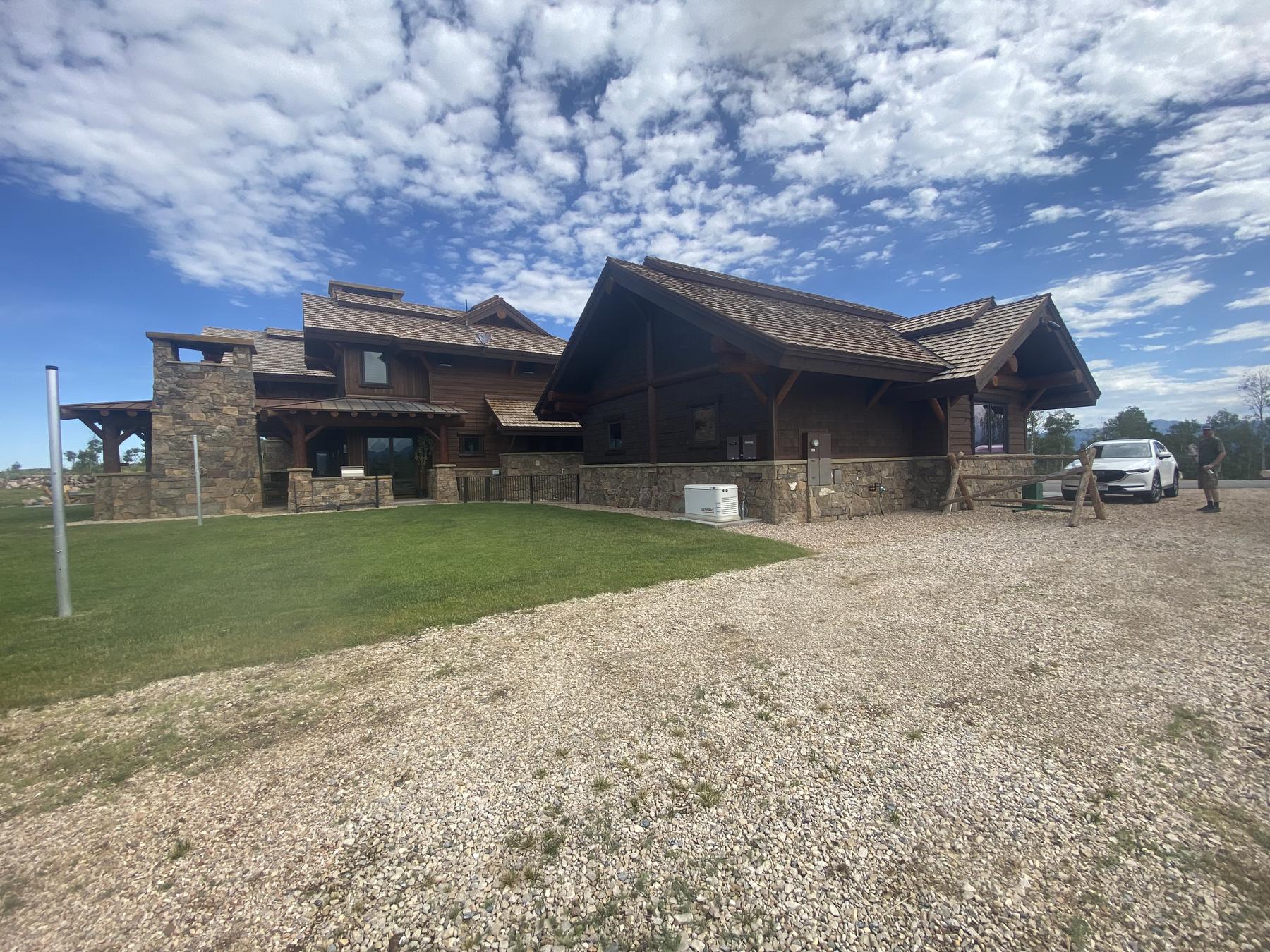 A timber and stone mountain home in Park City, Utah with a fresh exterior finish by Focus Custom Wallworks